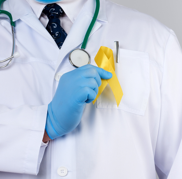Doctor holding a yellow ribbon.