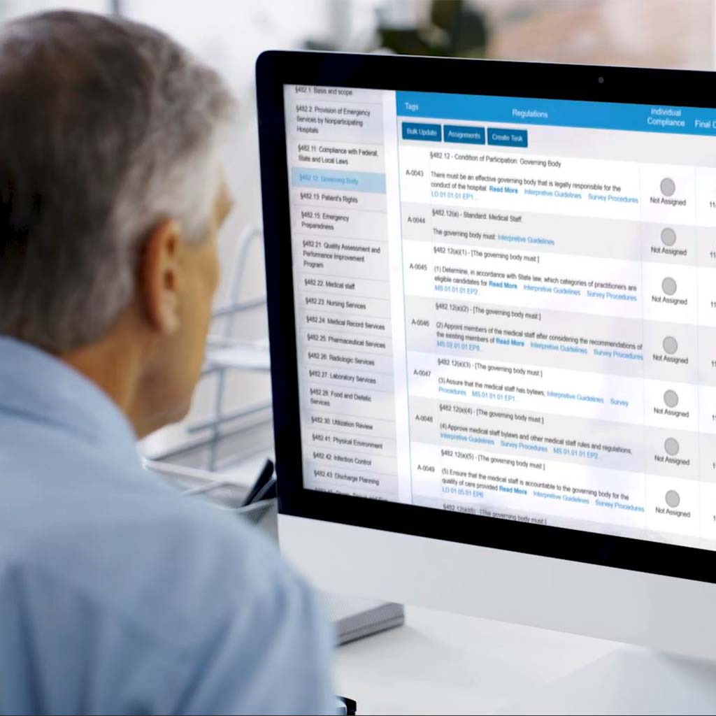 A man looking at a computer screen