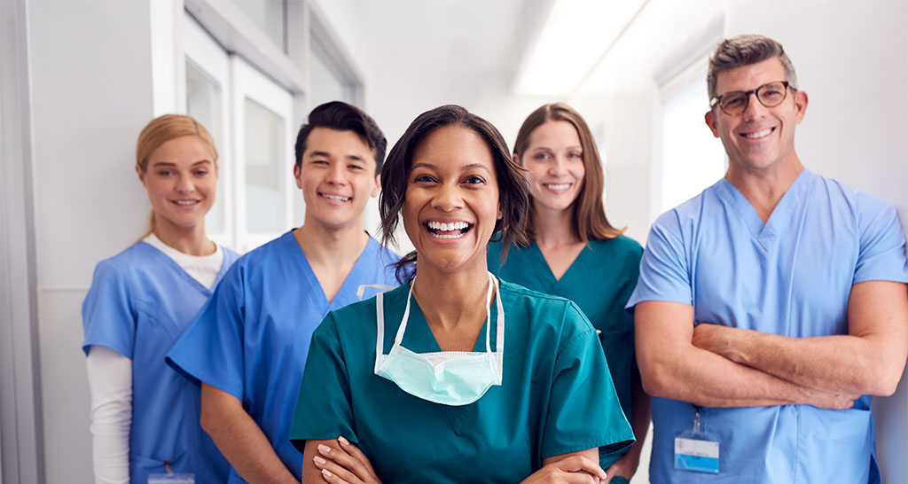 A group of nurses in a hospital hallway