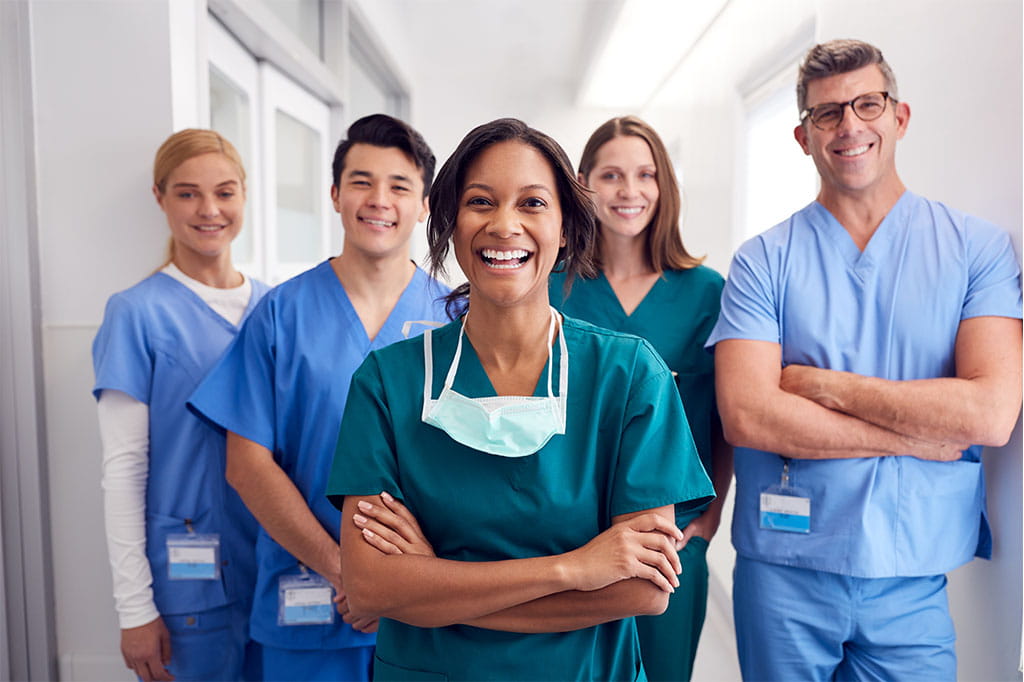 A team of medical professionals in a hospital hallway