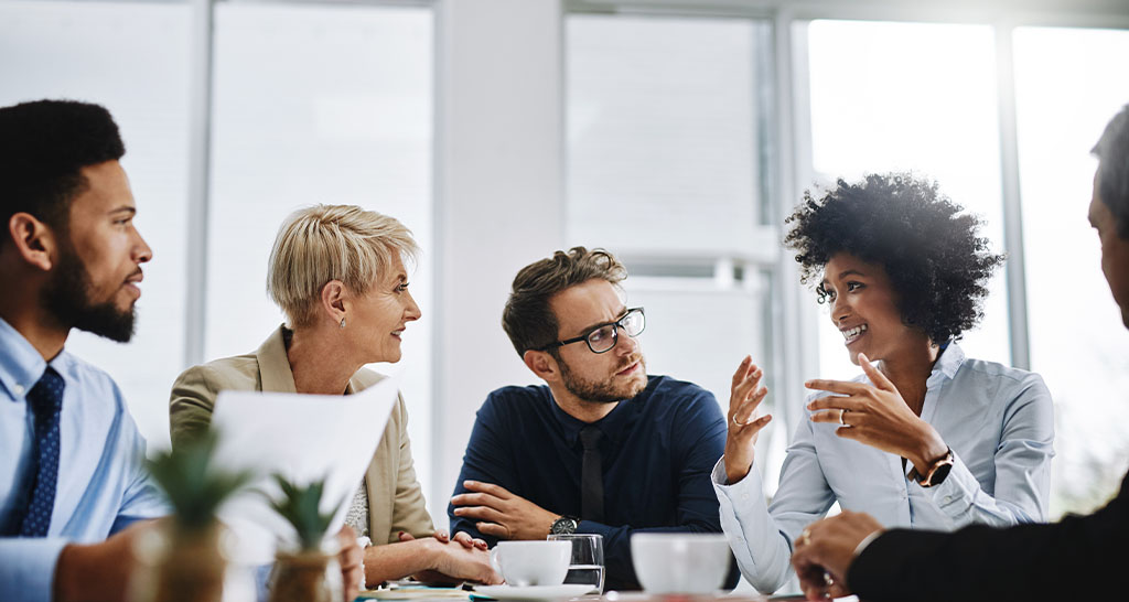 A group of professionals sitting together in a meeting